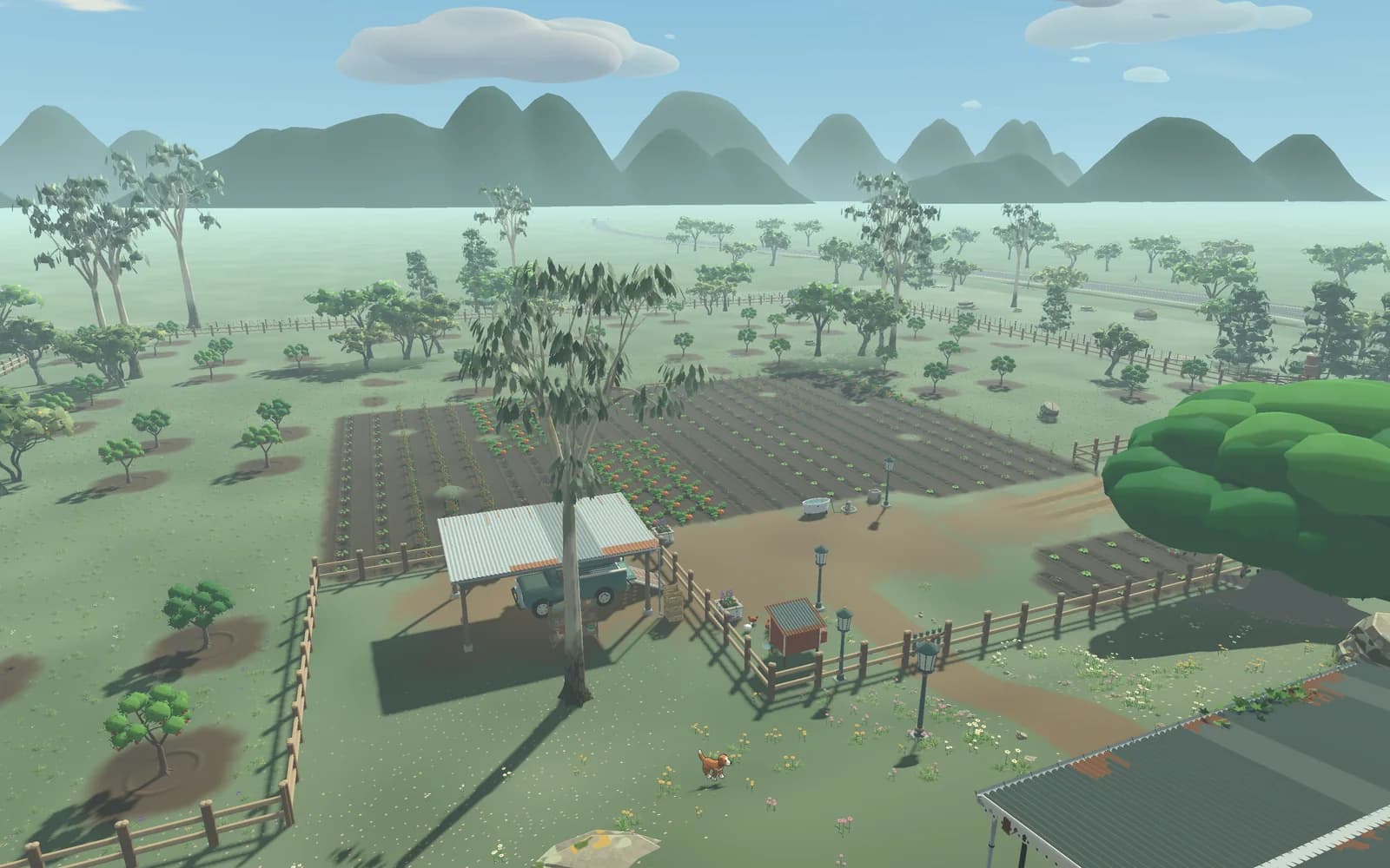 The farmyard with its shed, pickup and fences, planted fields and orchards behind